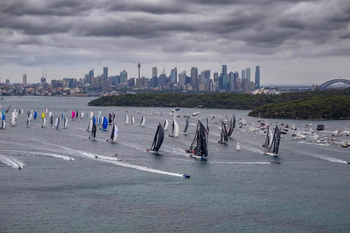 Sydney Harbour yacht fleet racing past the city skyline and Opera House